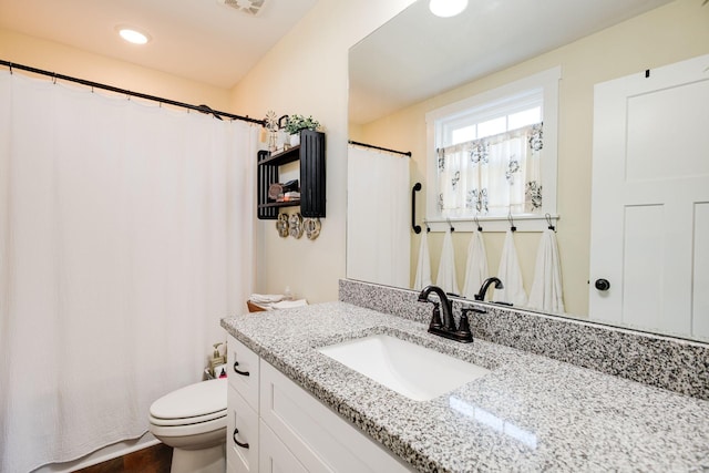 full bathroom featuring visible vents, recessed lighting, toilet, and vanity