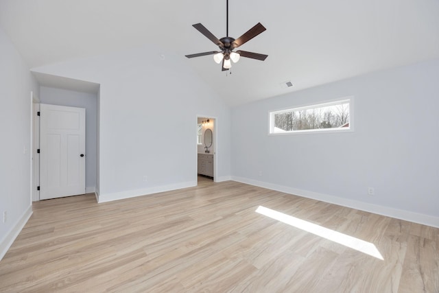 unfurnished bedroom featuring high vaulted ceiling, light wood-style flooring, visible vents, and baseboards