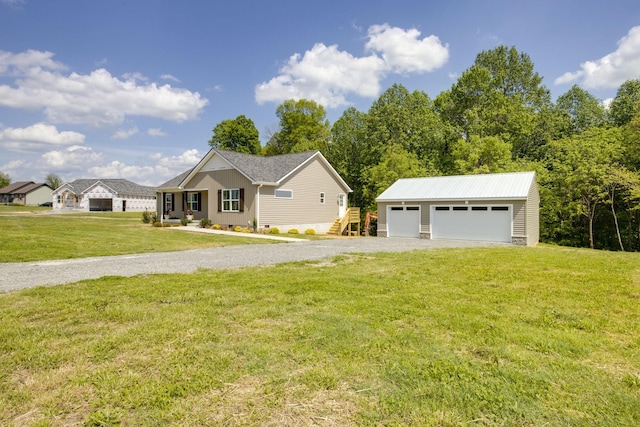single story home with an outdoor structure, a garage, a front lawn, and driveway