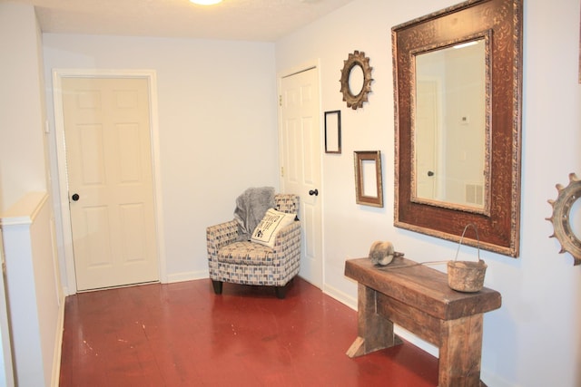 living area with wood finished floors and baseboards