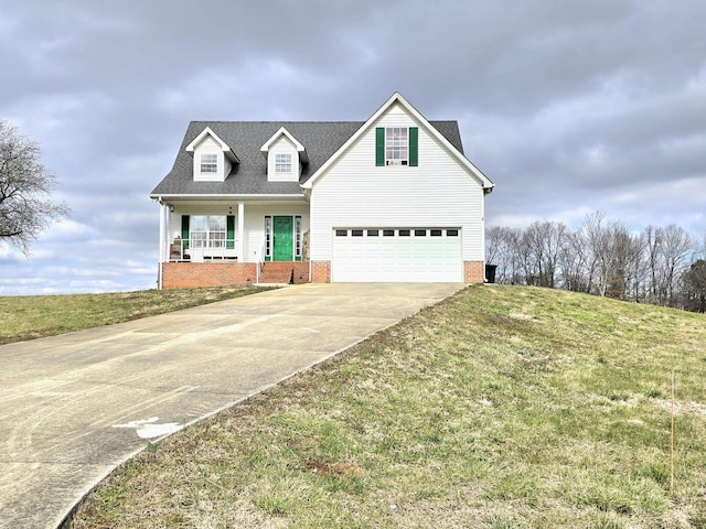 view of front facade featuring an attached garage, covered porch, concrete driveway, roof with shingles, and a front yard