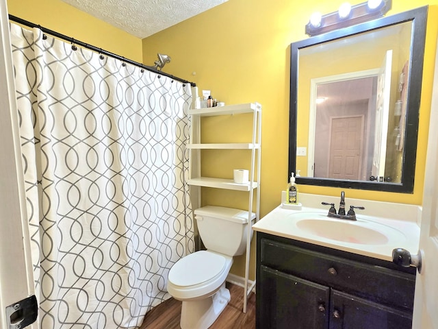 full bath with a shower with shower curtain, toilet, a textured ceiling, vanity, and wood finished floors