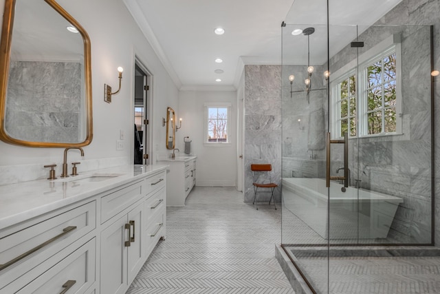 bathroom with two vanities, ornamental molding, a stall shower, a sink, and tile patterned flooring