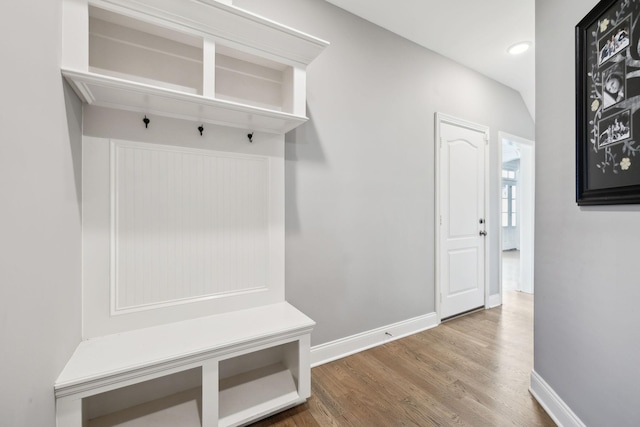 mudroom with recessed lighting, wood finished floors, and baseboards