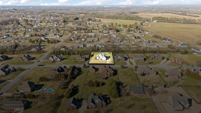 birds eye view of property with a residential view