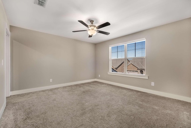 empty room featuring baseboards, visible vents, ceiling fan, and carpet flooring