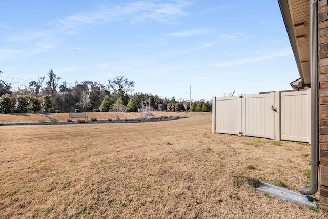 view of yard featuring a gate and fence