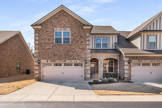 view of front of home featuring a garage, concrete driveway, roof with shingles, and brick siding