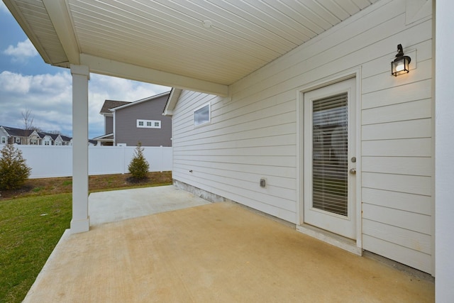 view of patio featuring fence