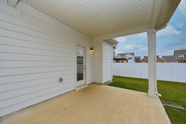 view of patio featuring fence