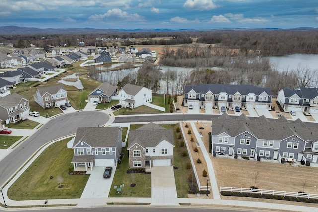 bird's eye view featuring a water view and a residential view