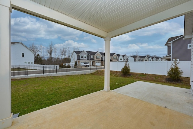 view of patio with a residential view and a fenced backyard