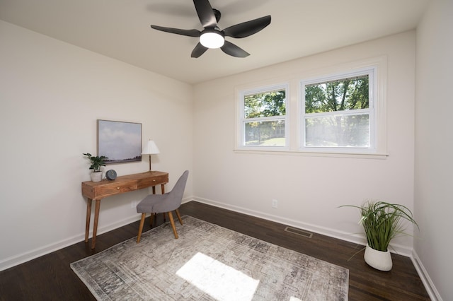 office with wood finished floors, visible vents, and baseboards