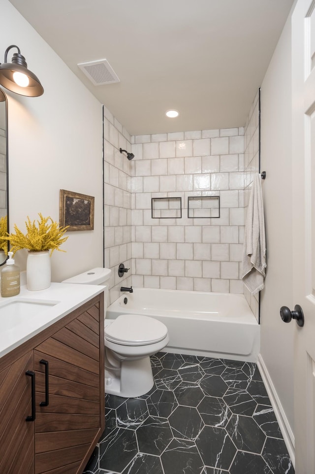 full bath featuring visible vents, vanity, toilet, and shower / bathtub combination