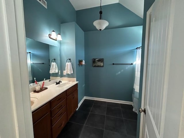 bathroom with double vanity, visible vents, a shower with shower curtain, tile patterned floors, and vaulted ceiling