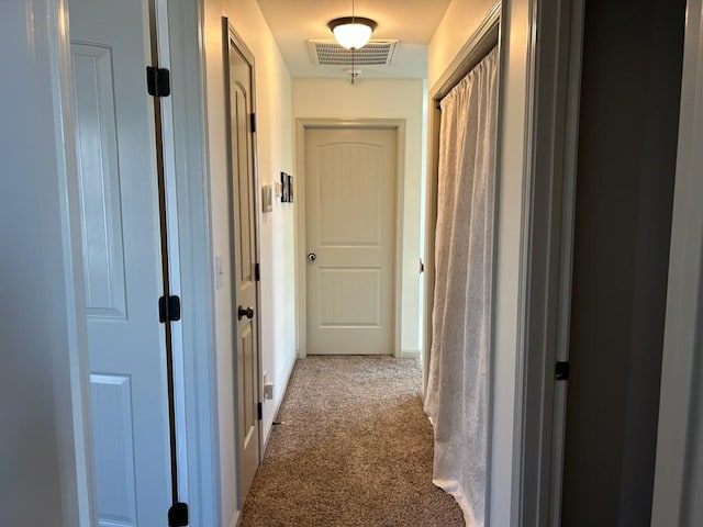 corridor featuring carpet and visible vents