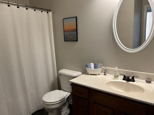 full bath with toilet and vanity