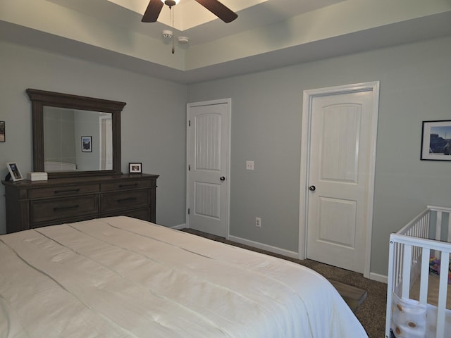 carpeted bedroom with baseboards and a ceiling fan