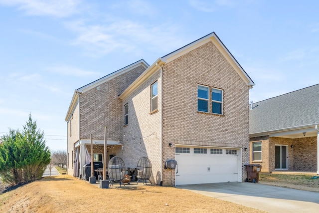 view of property exterior with a garage, concrete driveway, and brick siding