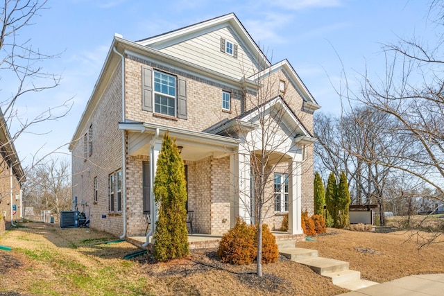 view of front of house featuring brick siding