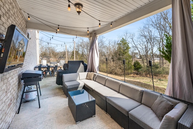 view of patio with outdoor dining area and an outdoor hangout area