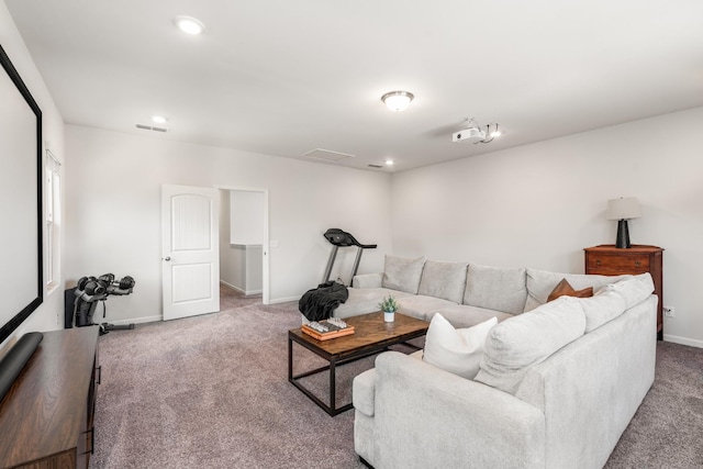 living area featuring carpet, visible vents, baseboards, and recessed lighting