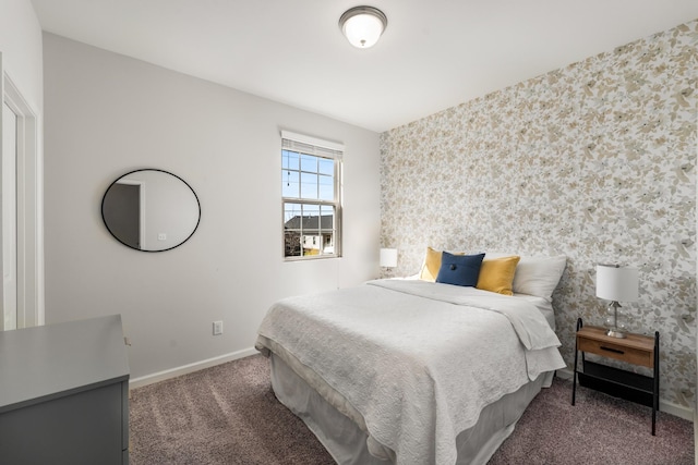 bedroom with wallpapered walls, carpet flooring, and baseboards