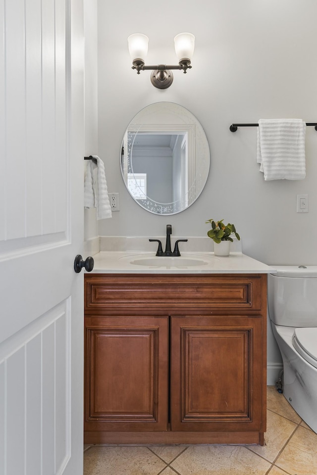 bathroom featuring vanity, toilet, and tile patterned floors