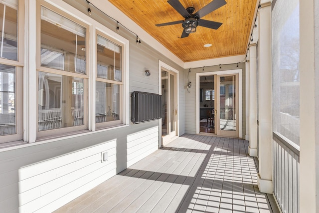 wooden terrace with a ceiling fan