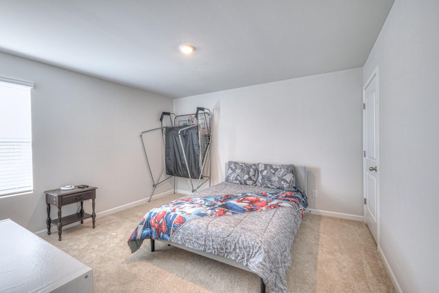 bedroom featuring carpet floors and baseboards