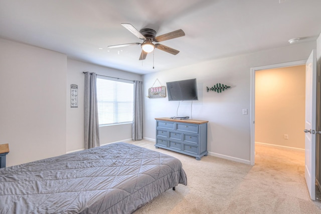 bedroom with light carpet, ceiling fan, and baseboards