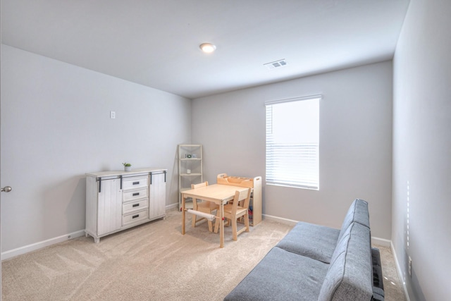 rec room with light carpet, baseboards, and visible vents