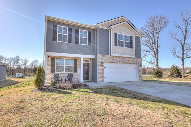 view of front of house featuring a front yard, brick siding, driveway, and an attached garage