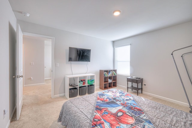 bedroom featuring carpet floors and baseboards