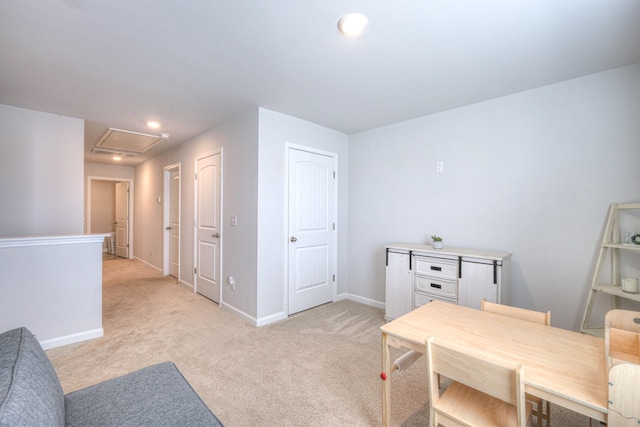 home office with light carpet and baseboards