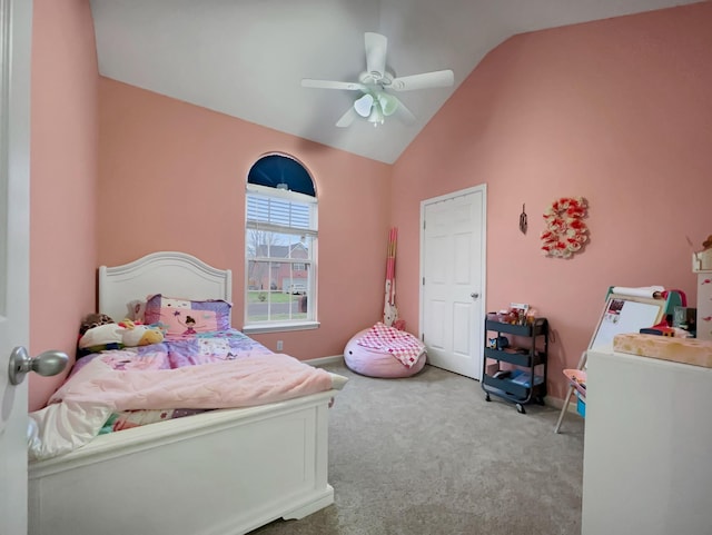 bedroom with baseboards, vaulted ceiling, a ceiling fan, and light colored carpet