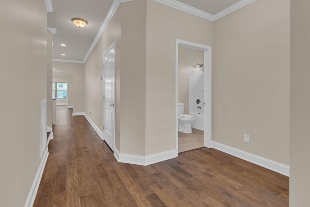 hallway with dark wood-type flooring and baseboards