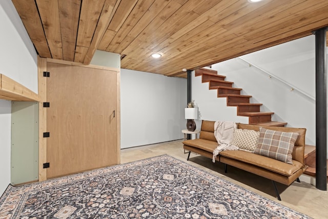 living area with recessed lighting, wooden ceiling, concrete floors, and stairway