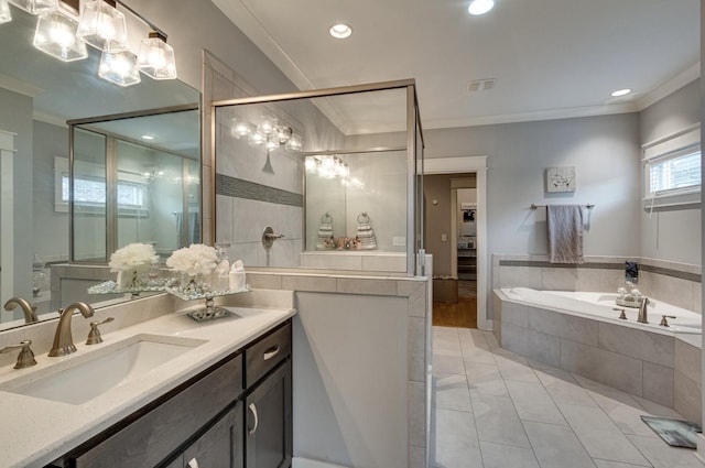 bathroom featuring visible vents, ornamental molding, a stall shower, vanity, and a bath