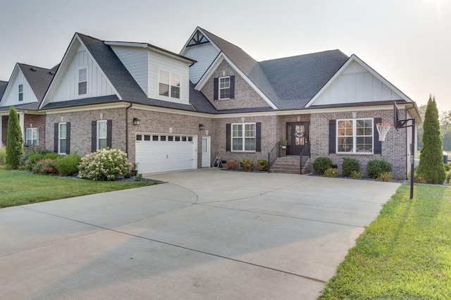 view of front facade with board and batten siding, a front yard, concrete driveway, and brick siding