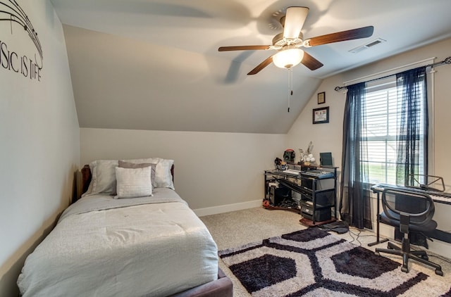 carpeted bedroom with ceiling fan, visible vents, baseboards, and vaulted ceiling