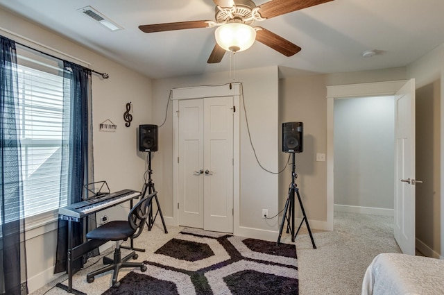 carpeted home office with visible vents and baseboards