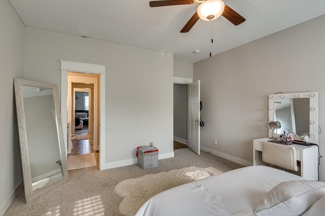 bedroom with carpet floors and baseboards