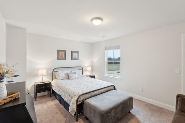 carpeted bedroom featuring baseboards