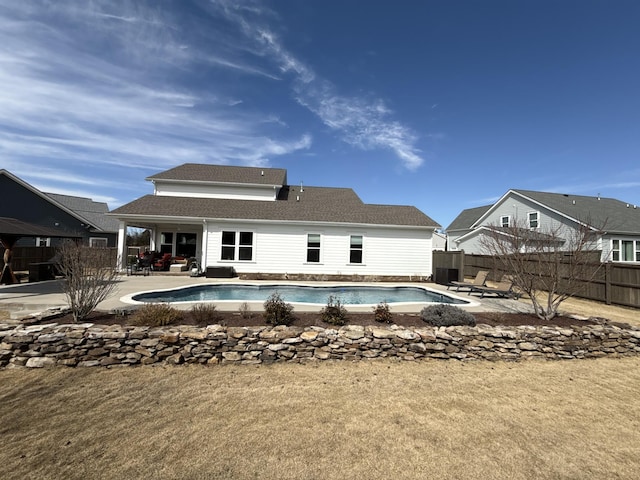 view of swimming pool with a fenced in pool, a fenced backyard, and a patio