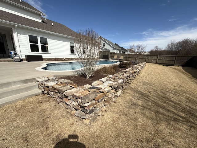 view of swimming pool with a patio area, a fenced backyard, and a fenced in pool