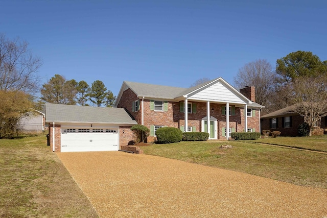 greek revival house with an attached garage, brick siding, concrete driveway, a front lawn, and a chimney