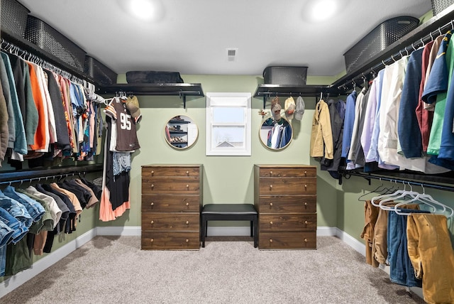 spacious closet with carpet floors and visible vents