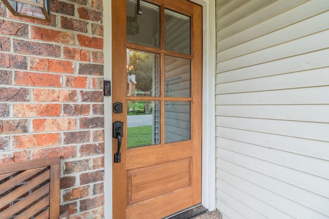 entrance to property with brick siding