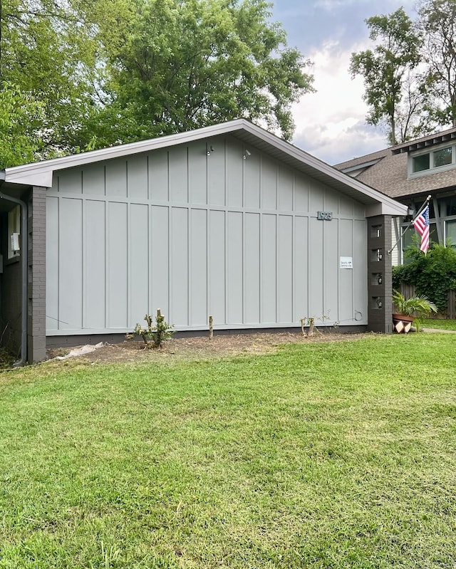 view of home's exterior featuring a yard and board and batten siding